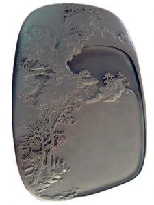 inkstone carved with mountain scene and temples