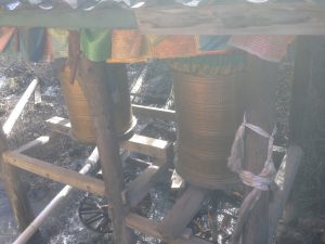 Tibetan prayer wheels turning forever in the water